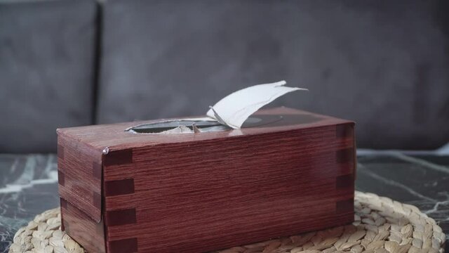 Female hand take tissue from box