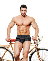 Shirtless muscular man with retro bicycle on white background