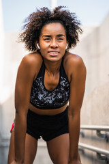 Athlete woman relaxing after work out outdoors.