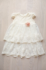 Fototapeta na wymiar Beautiful dress for little princess baby-girl. Clothes. Maternity. Waiting for baby-girl