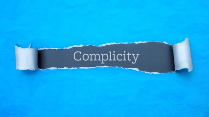 Complicity. Blue torn paper banner with text label. Word in gray hole.