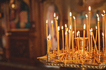 candles and lamp close-up. Interior Of Orthodox Church In Easter. baby christening. Ceremony a in Christian . bathing the into the baptismal font