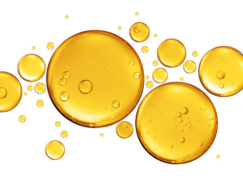 many golden yellow bubble oil or serum isolated on white background