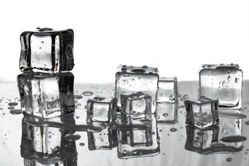 Melting Ice Cubes with reflections on a white background