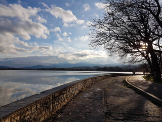 ioannina lake  evening in  winter season trees road in greece