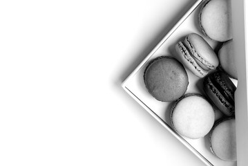 small macarons in the box with copy space black and white style
