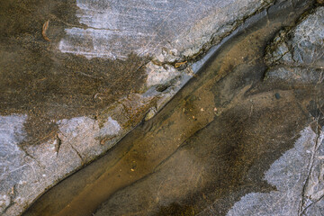 water flowing into the rocks on the ocean 