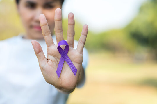 Pancreatic Cancer, world Alzheimer, epilepsy, lupus and domestic violence day Awareness month, Woman holding purple Ribbon for supporting people living. Healthcare and World cancer day concept