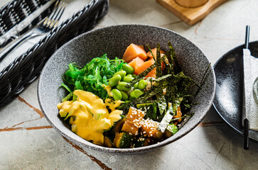 buddha bowl with fish and seaweed