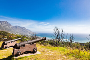 Shot of military cannons overlooking camps bay beach on the atlantic seaboard of Cape Town