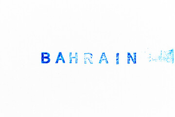 Blue color ink of rubber stamp in word bahrain on white paper background