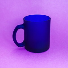 Purchased mug of blue glass closeup on a pink background