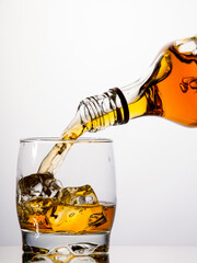 Pouring whisky from a bottle