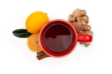Obraz na płótnie Canvas Red Cup of hot black or green tea with lemon and ginger on a white background. Ingredients against influenza and viruses. Natural medicine.