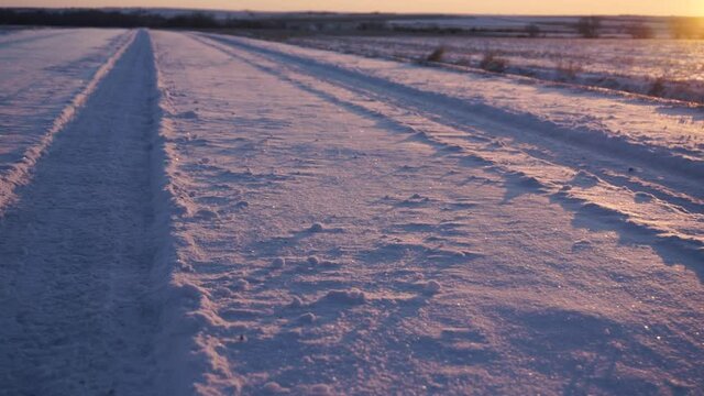 Closeup of Tracks on a Snowy Road