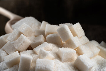 Refined sugar and sugar on a dark background. Sugar on burlap