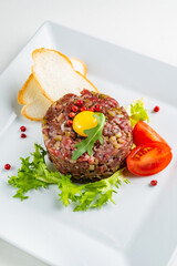 French cuisine, beef steak tartare with raw quail egg yolk