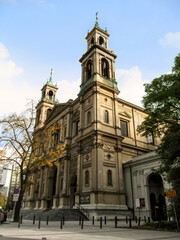 Warsaw, Poland - October 9, 2018: All Saints Church in Warsaw, side view. Ancient temple with two tall bell towers  in the neoclassical style on an autumn day
