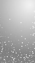 Magic stars random Christmas background. Subtle flying snow flakes and stars on grey background. Alluring winter silver snowflake overlay template. Fresh vertical illustration.