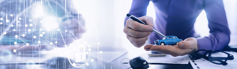 The insurance agent signs a document. Car insurance policy. Auto insurance policy. Forms for...