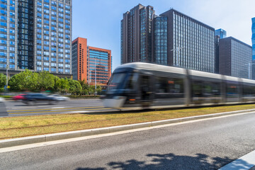 Obraz premium driving tramcar at sunny day, nanjing city.