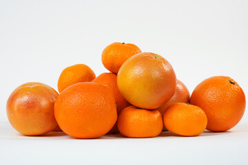 Citrus fruits on white. Oranges, grapefruits isolated on white background. Product for sale. Studio photo.  Copy space. 