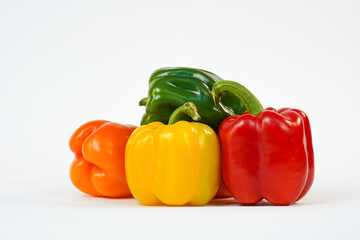 Fresh vegetables on white.  Food Concept. Sweet red, yellow, orange, green pepper.  Product for sale.  Copy space. High resolution.