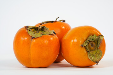  Delicious fresh persimmon fruit isolated on white background. Organic goldcrest. Copy space. Food market. Product for sale. High quality 4k video.