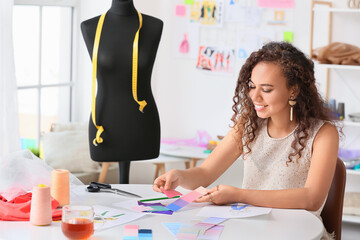 Female fashion designer working in studio