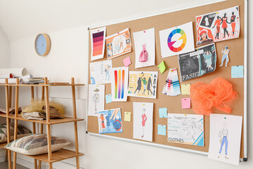 Board with pictures at fashion designer's studio
