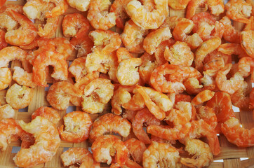 Dried salted prawn in bamboo basket.