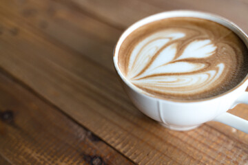 Cup of coffee with latte art pattern