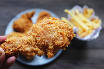 Woman holding fried chicken,Top view.