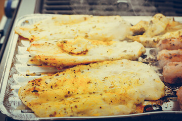 Chicken meat on grill