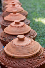 Fototapeta na wymiar Northern Thai style water clay pot on natural background.