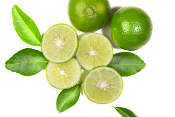 Naklejka na ściany i meble Fresh green Thai lemons, whole and sliced ​​with their leaves, placed on a isolated white background. With copy space.