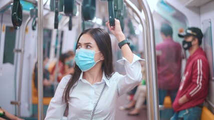 A young business woman is wearing face mask in public transportation , safety travel , covid-19 protection concept..