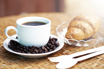cup of coffee with croissant