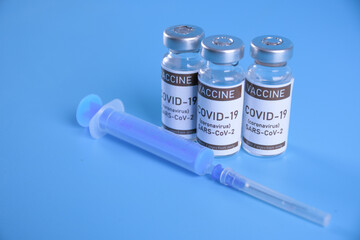 Coronavirus vaccine - The medical concept. Ampoule with Covid-19, SARS-Cov-2 vaccine. Copyspace. Vaccination, immunization, treatment to cure Covid 19 Corona Virus infection Concept