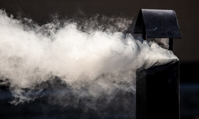 White smoke from the chimney. Background