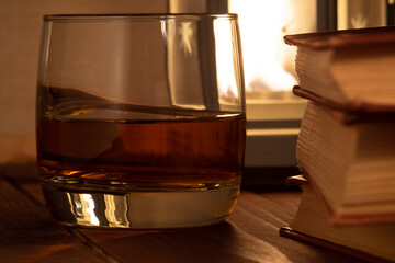 books, glass and whisky