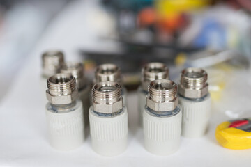 Combined couplings for connecting metal and polypropylene water pipes