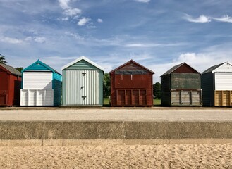 Fototapeta premium Beautiful sunny ocean sea waterfront with beach huts