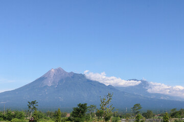 Fototapeta premium Aerial view of Mount Merapi Landscape with rice field and village in Yogyakarta, Indonesia Volcano Landscape View