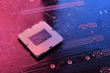 Computer cpu processor chip on circuit board ,motherboard background. Close-up. With red-blue...