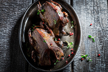 Top view of two wild pigeons roasted with spices
