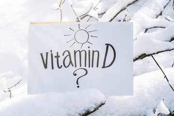 Vitamin D help in treating coronavirus. Vitamin D and question mark on white background.