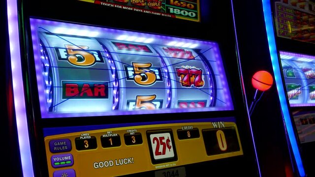 Close up woman playing slot machine inside Hard Rock Casino with 4k resolution