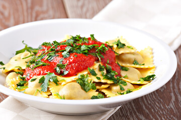 Ravioli with tomato sauce. Typical italian dish.