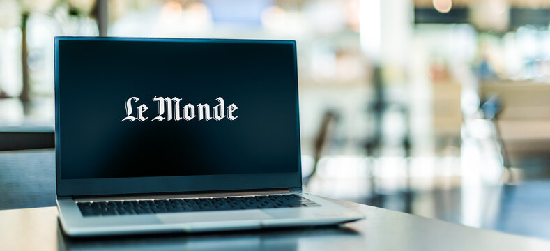 Laptop Computer Displaying Logo Of Le Monde